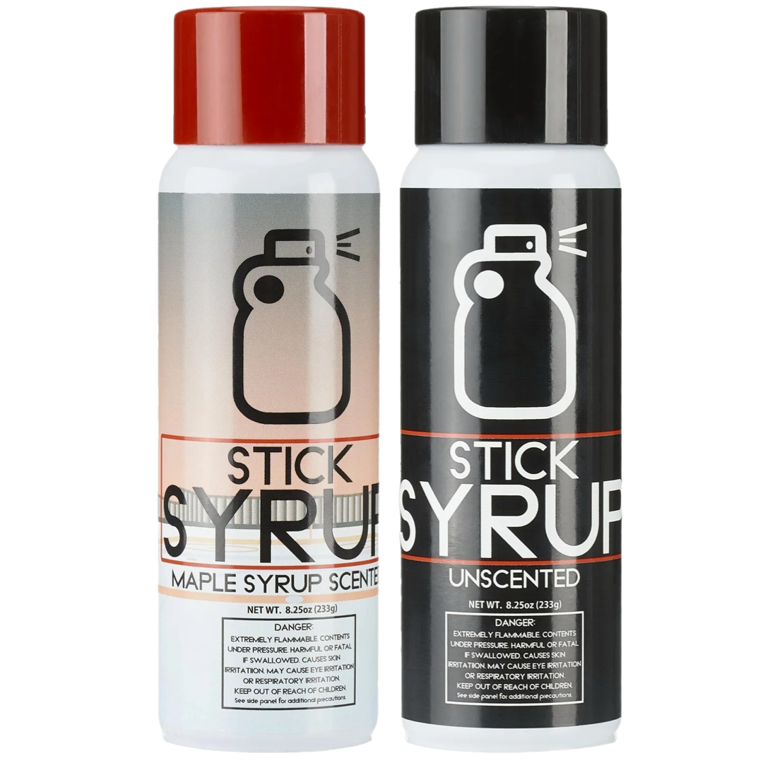 Two bottles of Stick Syrup, one with a red cap and one with a black cap, on a white background.